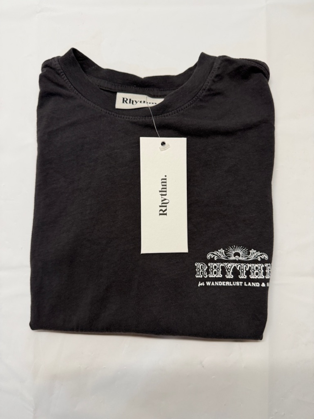 Rhythm. Black Short Sleeve Tee‎ with White Chest Graphic